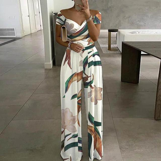 Tuta da donna Leah - Elegante tuta con spalle scoperte, gambe larghe e cintura in vita