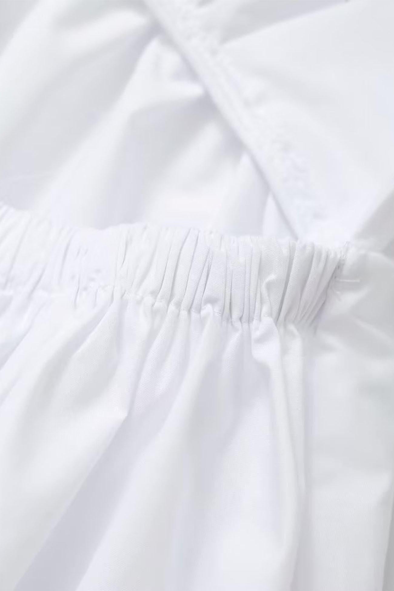 Abito midi da donna Jannie: abito bianco con scollo a V e schiena scoperta per un'eleganza estiva