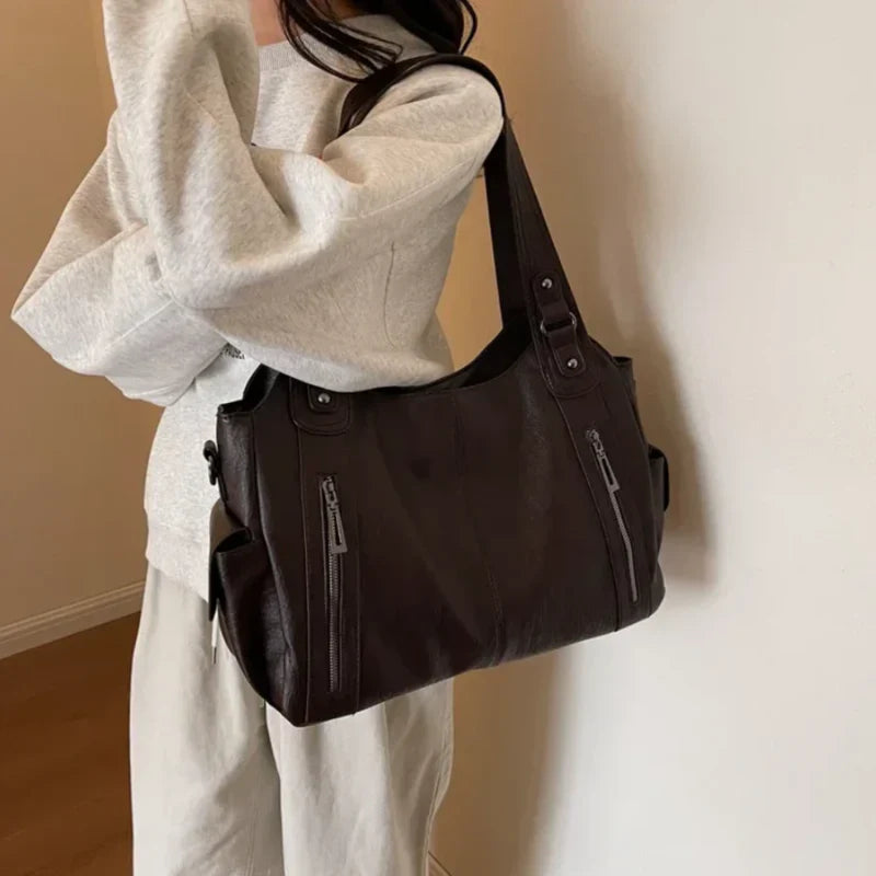 Borsa a tracolla da donna Dakota - Elegante borsa in pelle con tracolla regolabile e design spazioso