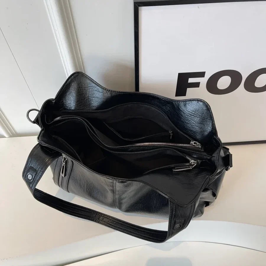 Borsa a tracolla da donna Dakota - Elegante borsa in pelle con tracolla regolabile e design spazioso