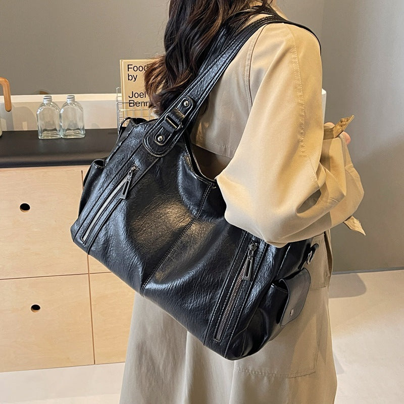 Borsa a tracolla da donna Dakota - Elegante borsa in pelle con tracolla regolabile e design spazioso