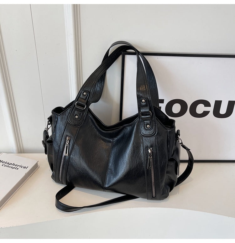 Borsa a tracolla da donna Dakota - Elegante borsa in pelle con tracolla regolabile e design spazioso