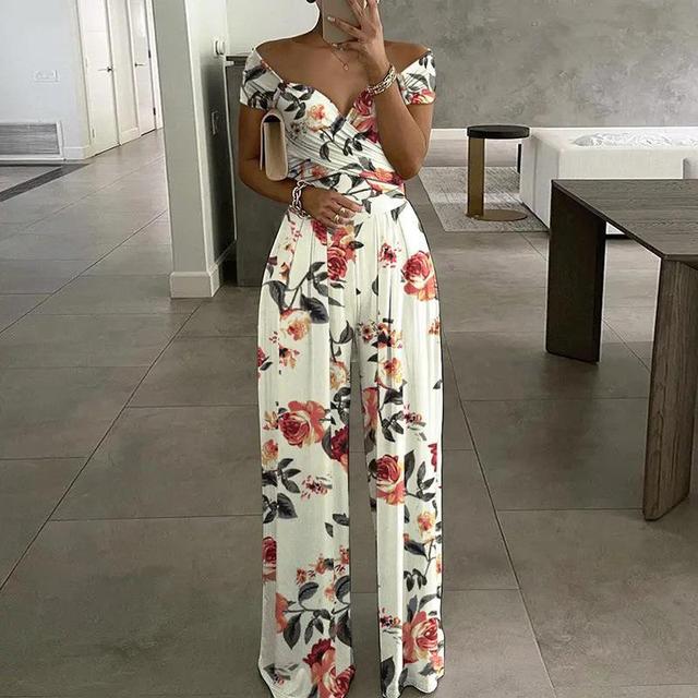 Tuta da donna Lilibeth - Elegante tuta a gamba larga con spalle scoperte e cintura